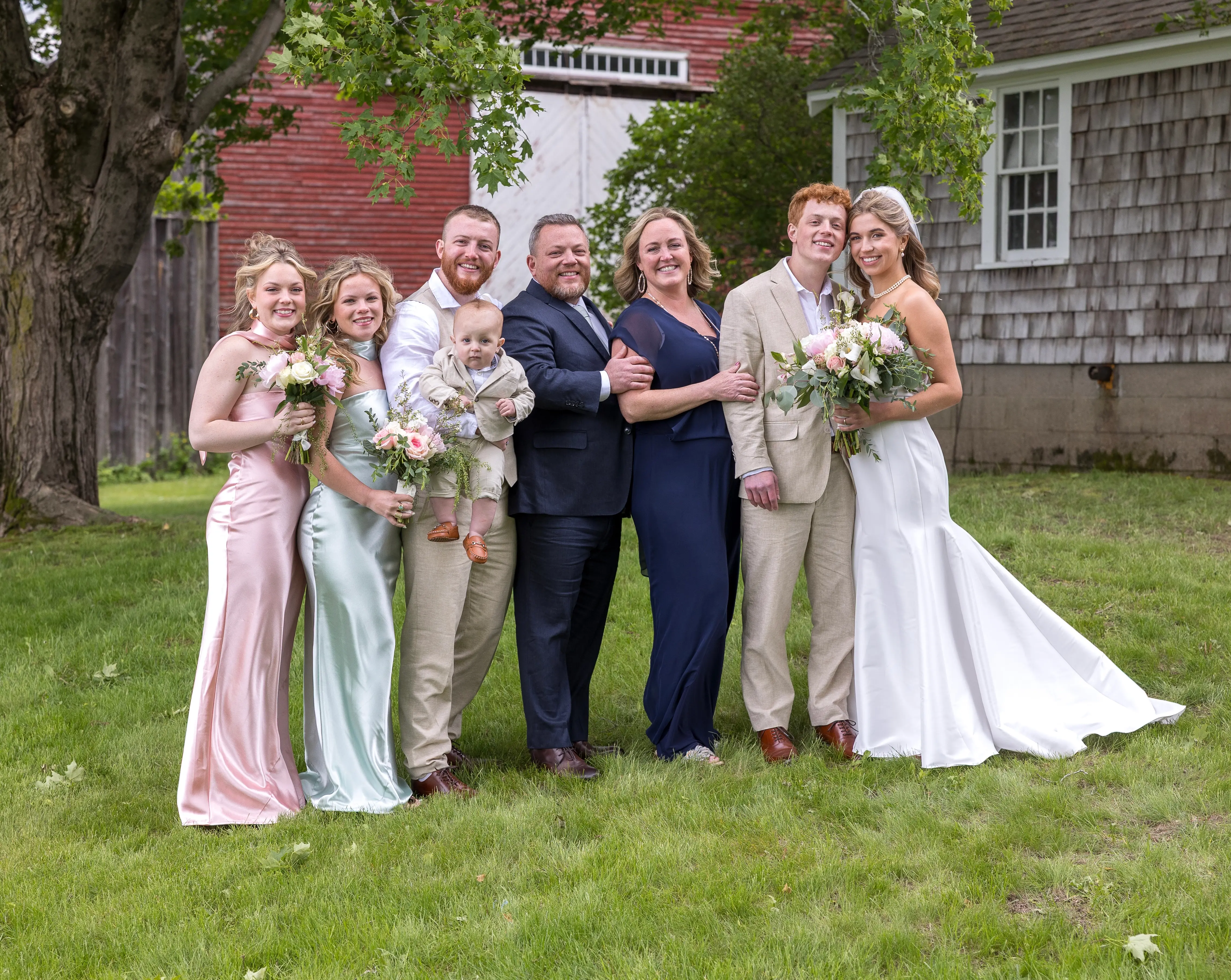 The Veader family gathered together, two generations of the family behind Benchmark