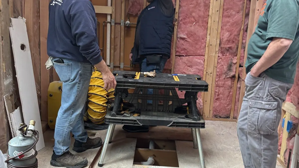 A remodel in progress with new framing and rough-in visible in a Seacoast New Hampshire home by Benchmark
