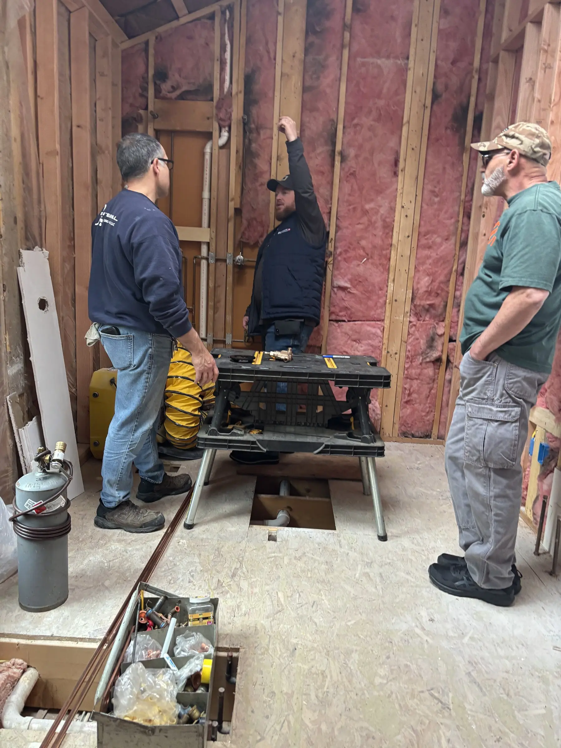 Benchmark crew working on the framing and rough-in of a bathroom remodel on the New Hampshire Seacoast
